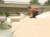 skater_floating_on_water_funny_animated_gif